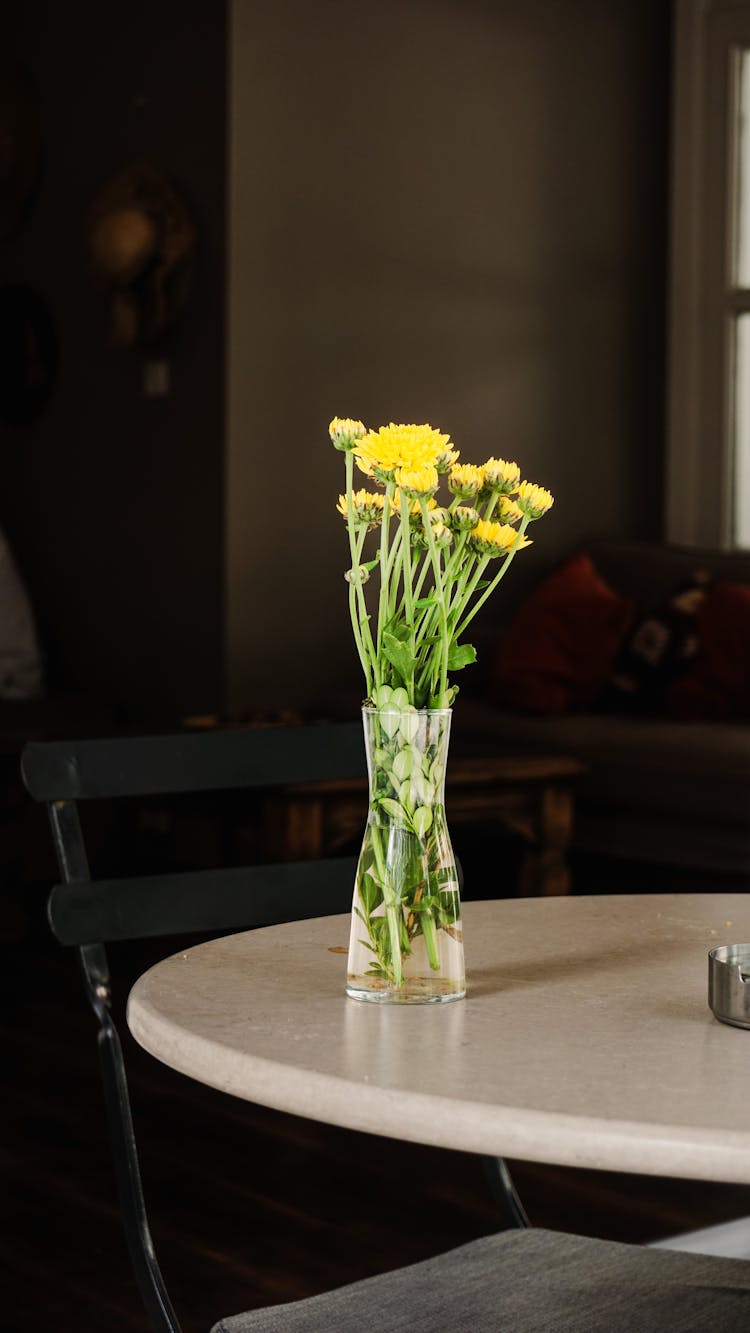 Flowers In Vase On Table