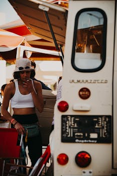 Casual woman by camper van, enjoying leisure time in Ankara, Türkiye.