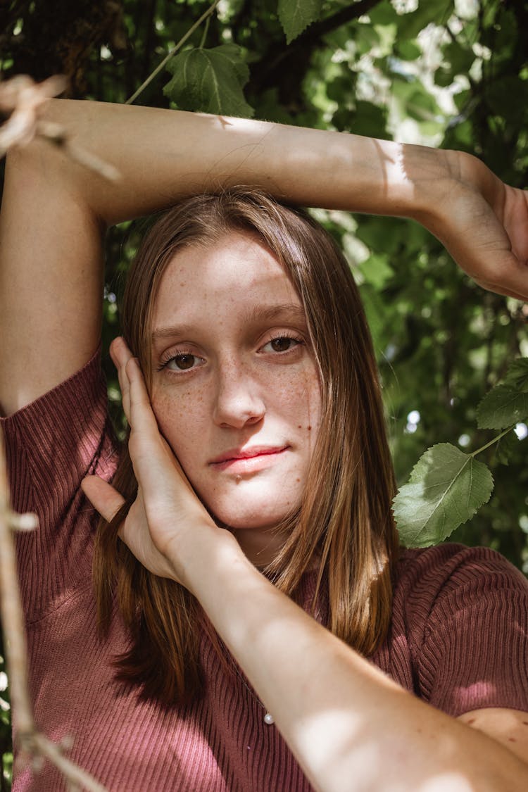 Portrait Of Woman Among Leaves