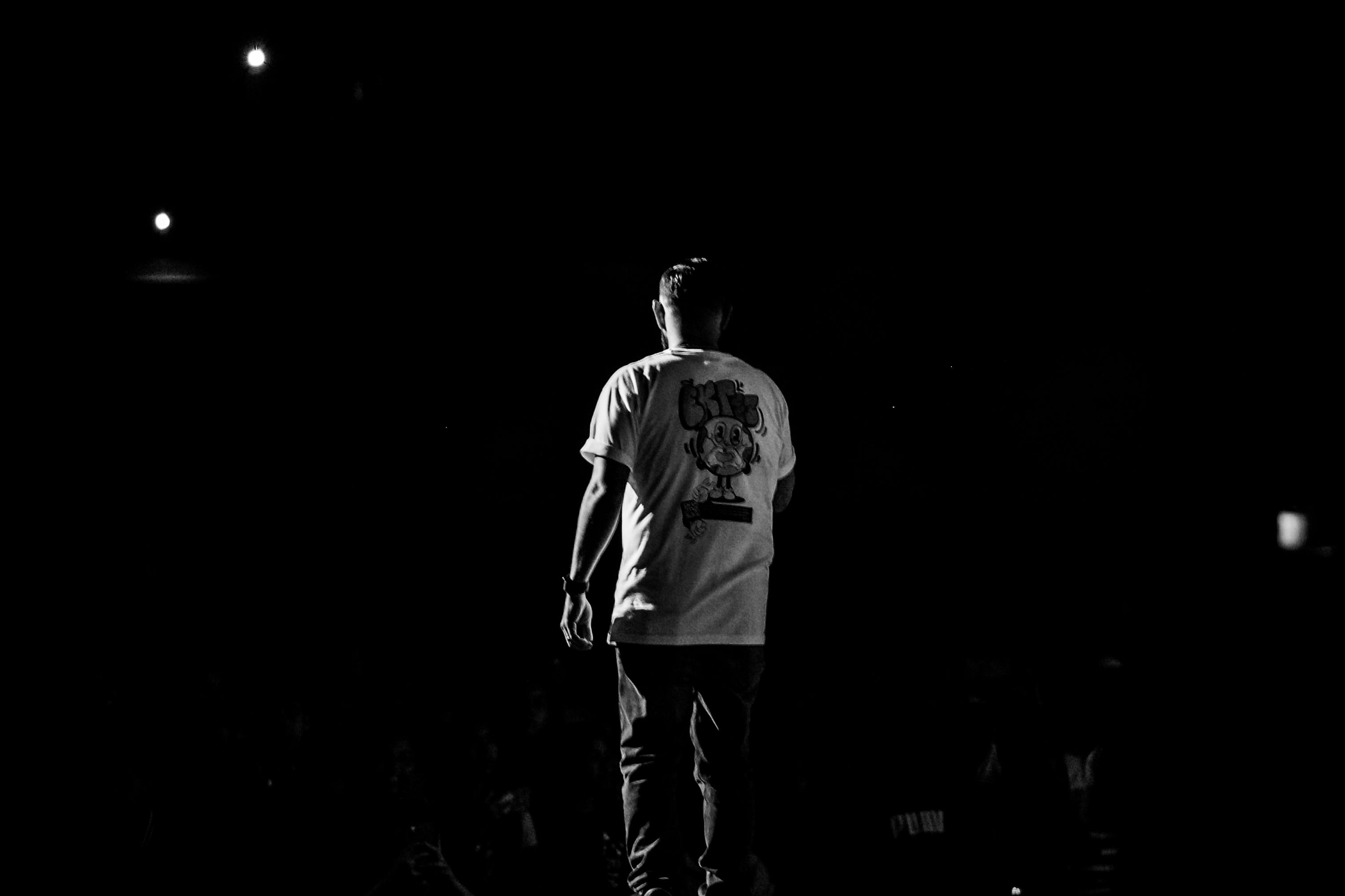 Back view of a man on stage free stock photo