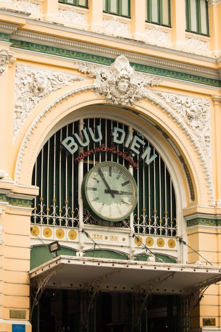 Entrance to the historic Saigon Central Post Office in Hồ Chí Minh City, Vietnam, showcasing ornate architecture.