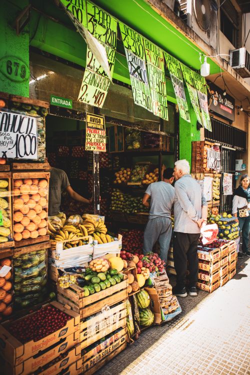 Free Bustling street market in Buenos Aires featuring colorful fruits and vegetables. Stock Photo