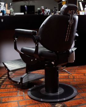 A classic barber chair inside a stylish salon, perfect for grooming needs.