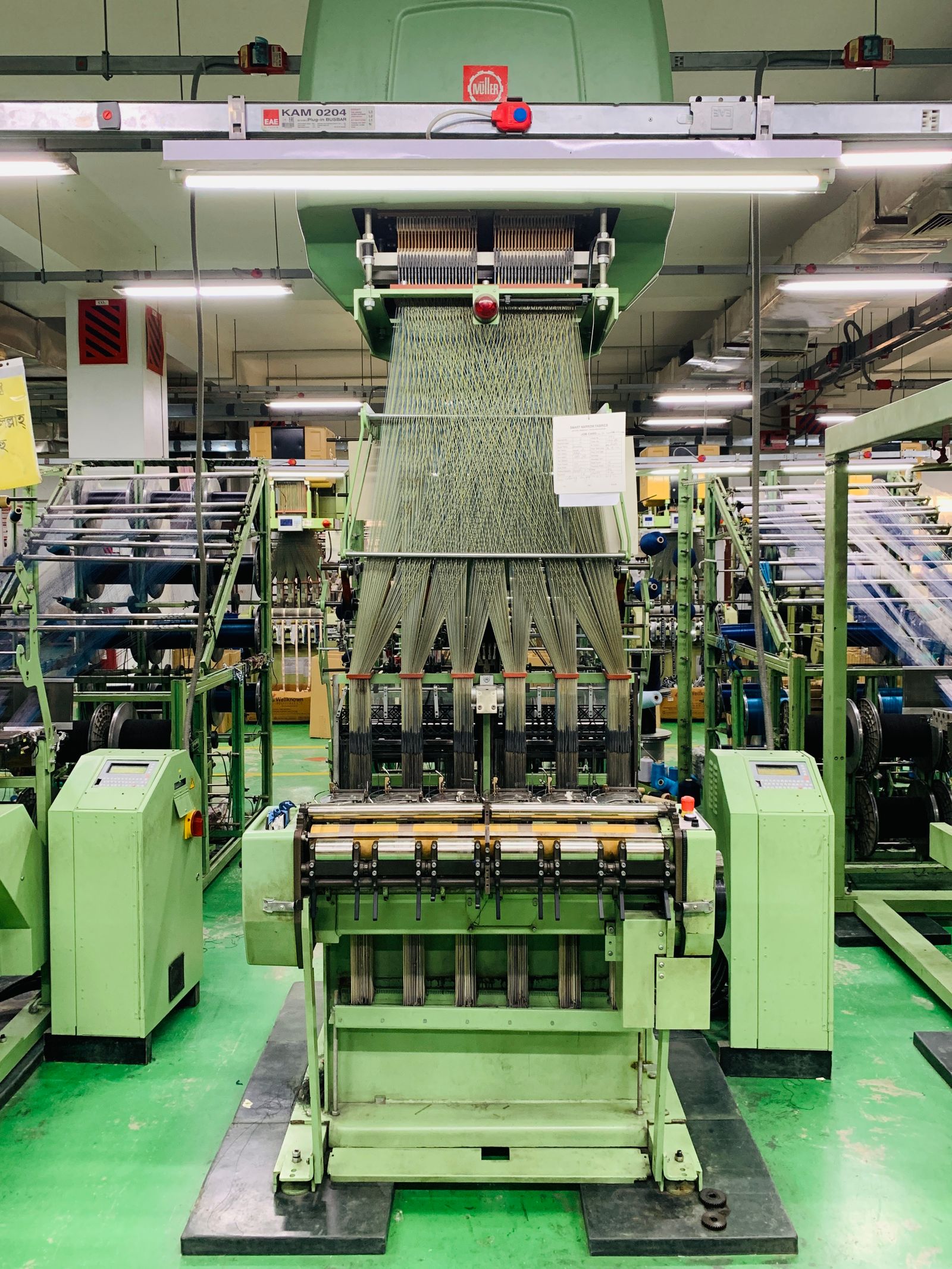 High-tech textile machine producing yarn in a factory in Mymensingh, Bangladesh