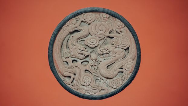Decorative Roundel with Stone Carving of Dragons
