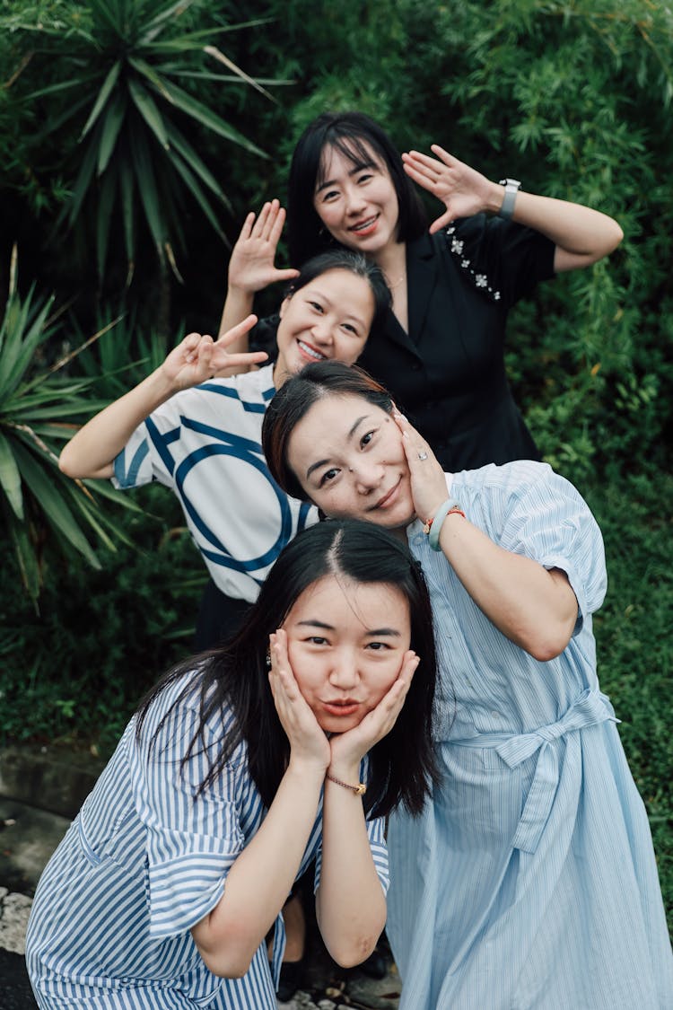 Group Of Young Women Posing In A Park