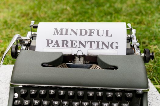 A typewriter with the word mindful parenting written on it