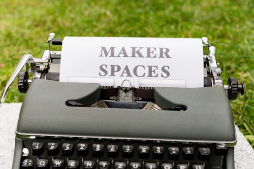 A typewriter with the words maker spaces written on it