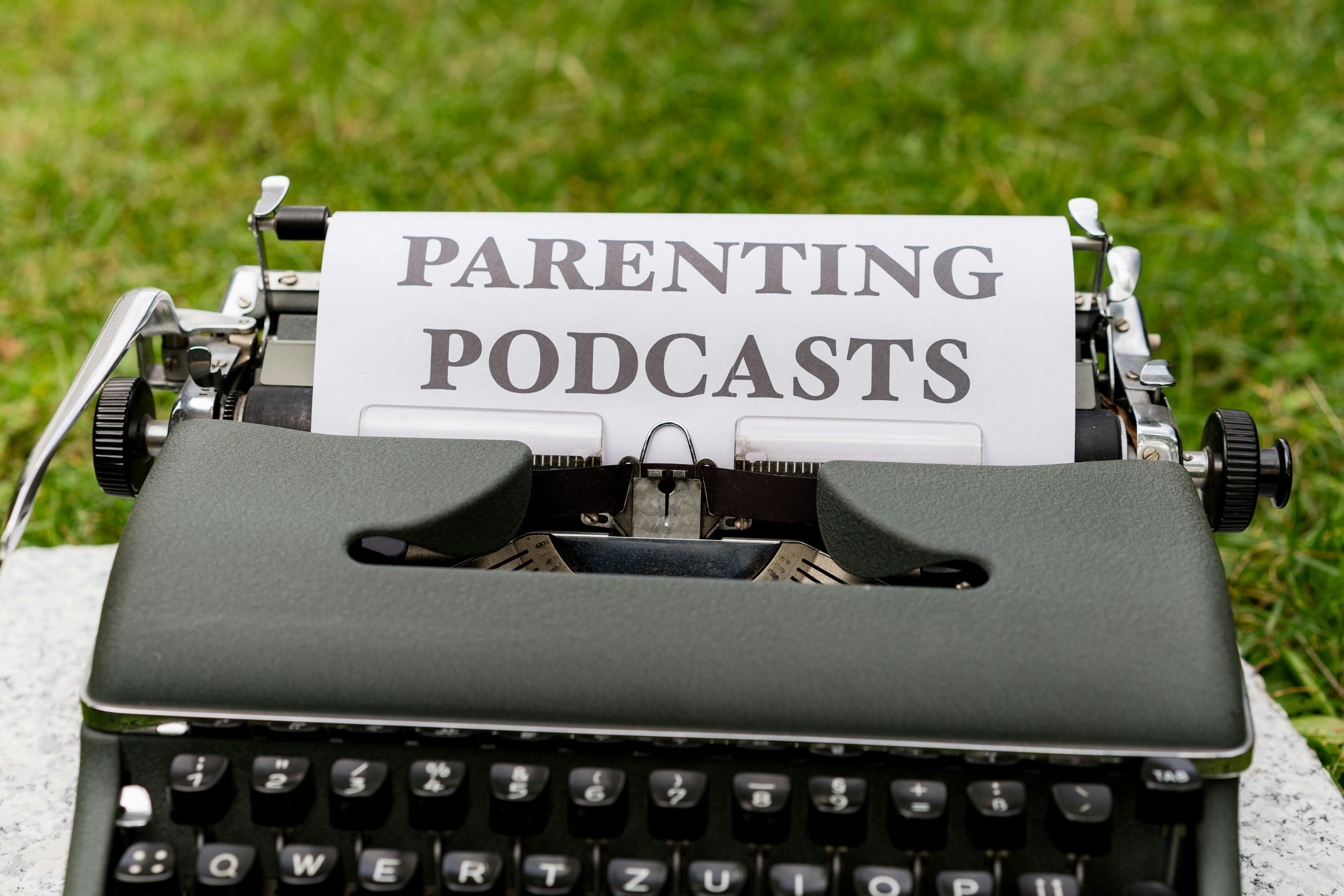 a typewriter with the words parenting podcasts on it