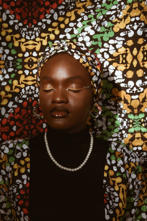 Portrait of a Young Woman Wearing a Turban and Glamour Makeup 