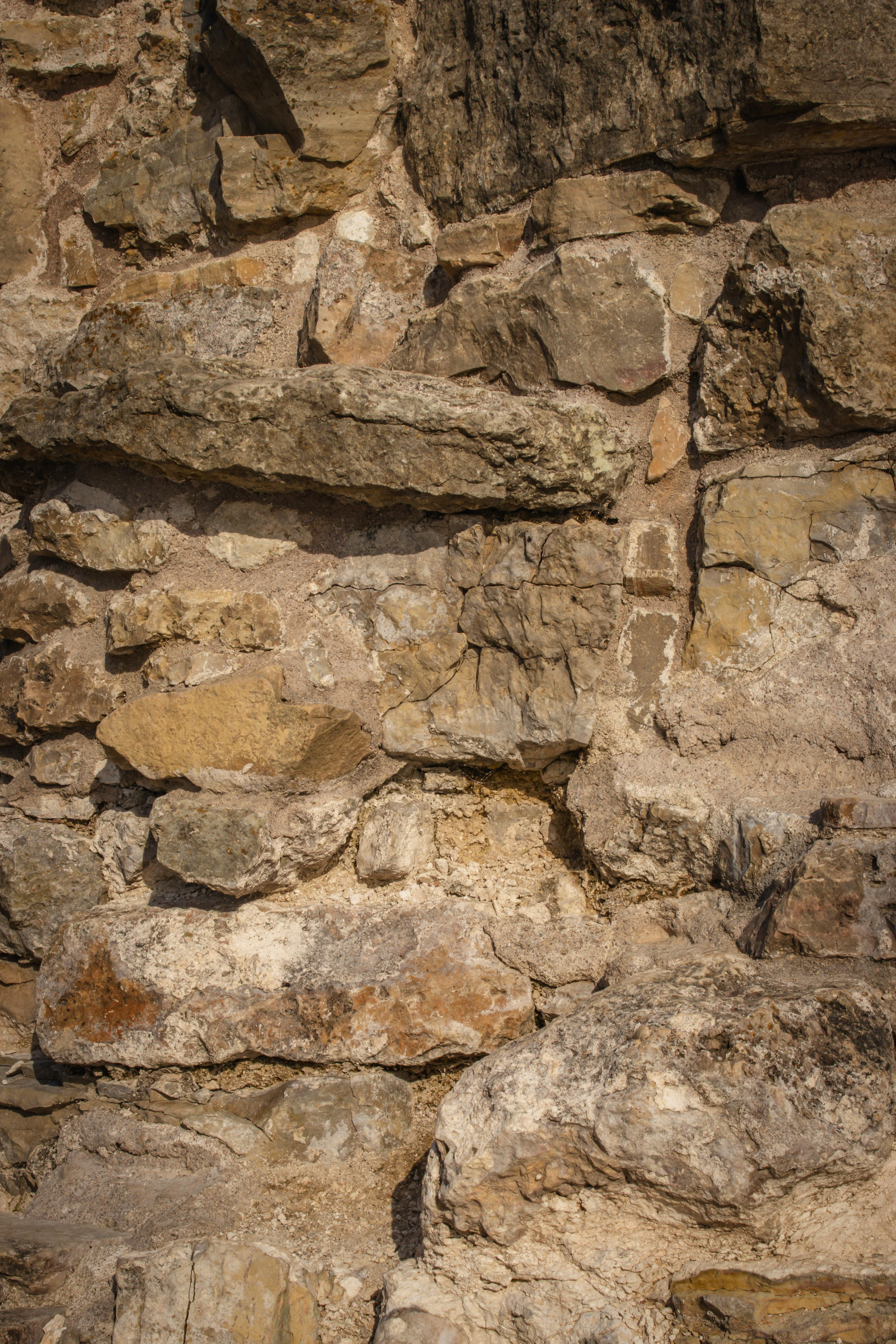 Closeup of a Rough Stone Wall · Free Stock Photo
