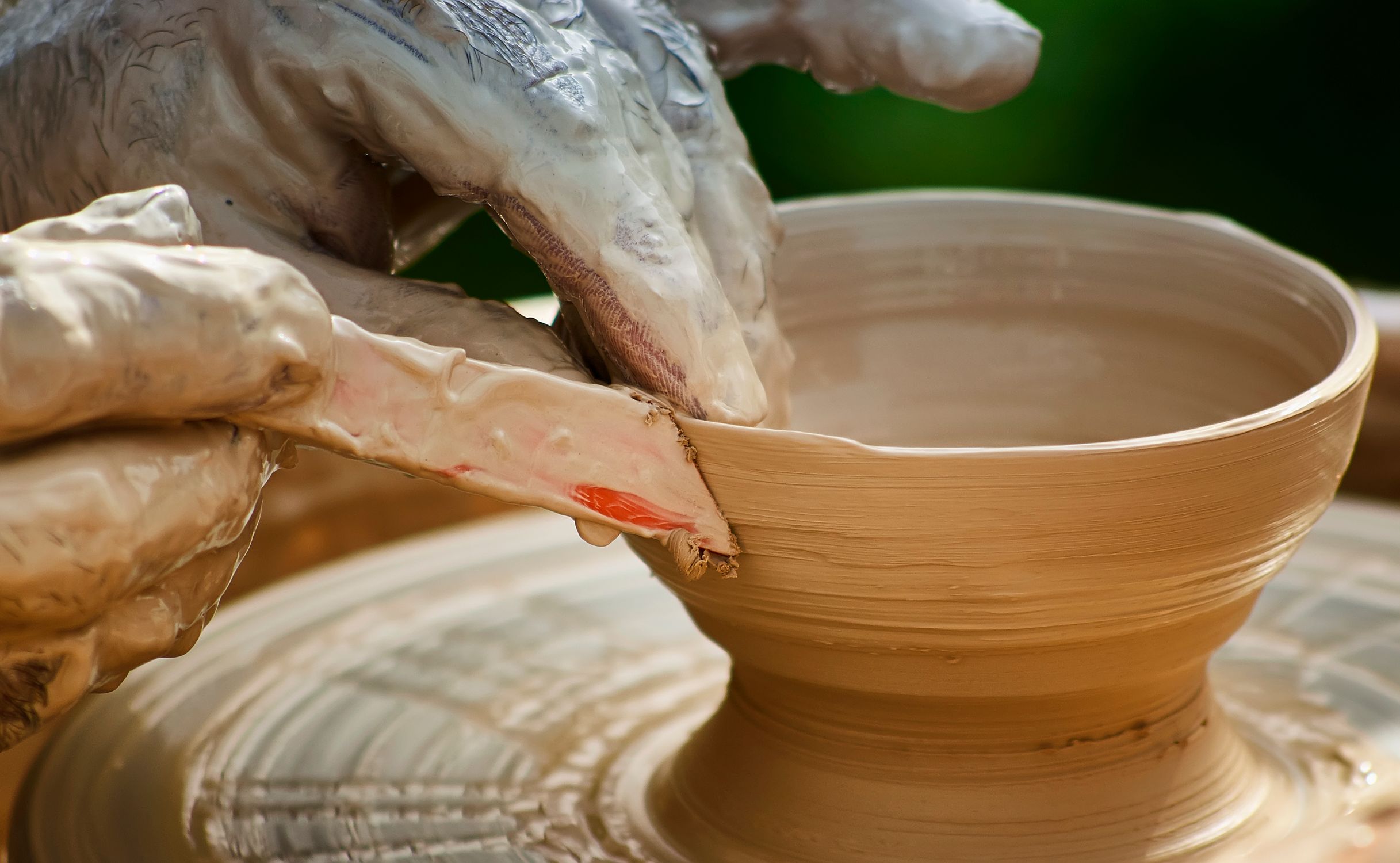 Person Using Clay Close-up of a Person Forming Clay on a Pottery Wheel · Free Stock Photo