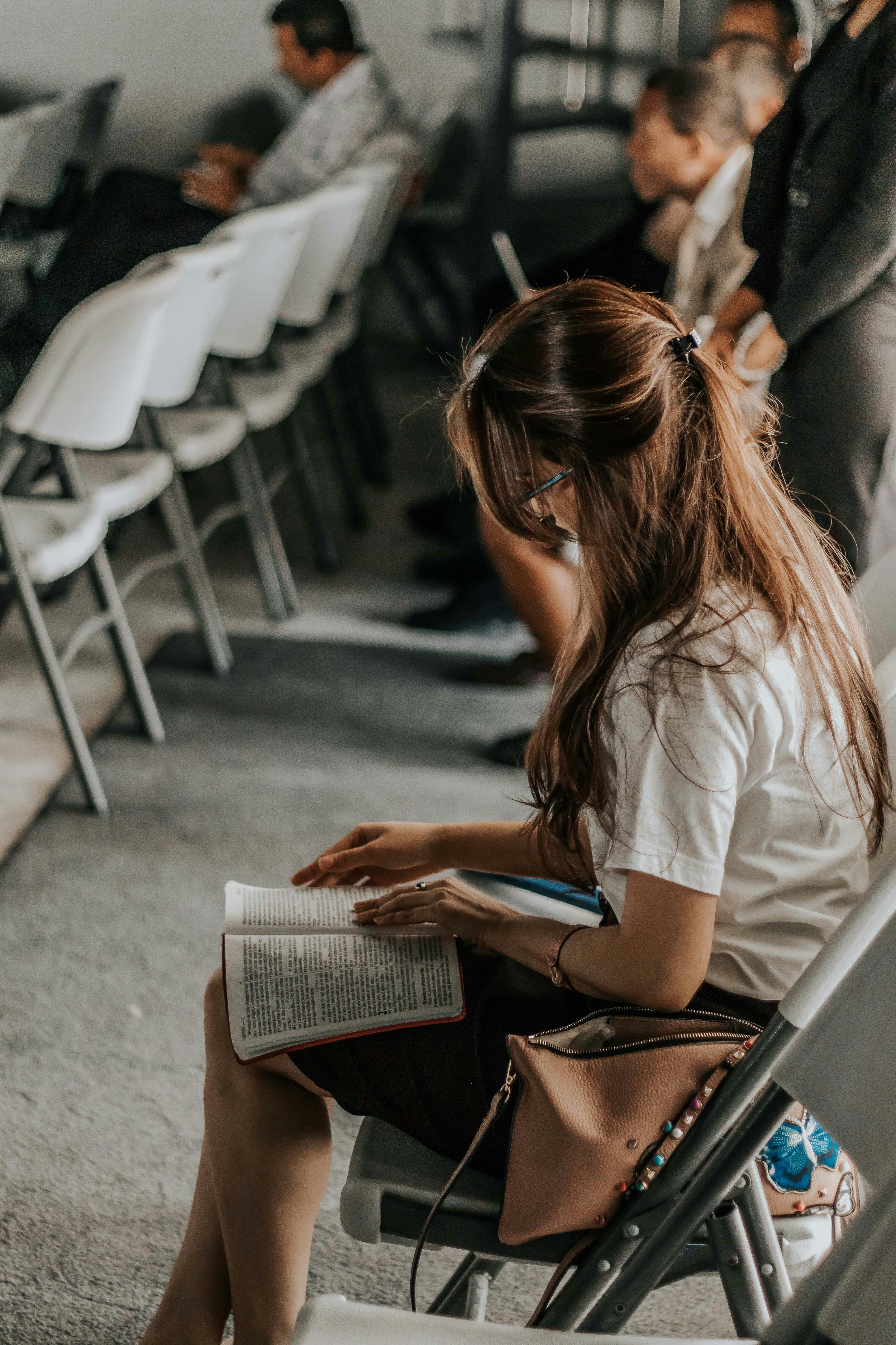 Woman Holding Book · Free Stock Photo