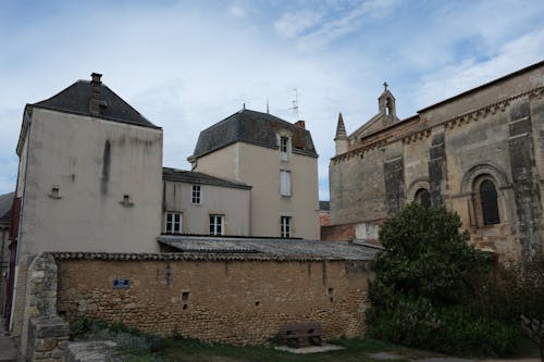 Buildings and Side View of a Cathedral in Airvault, France