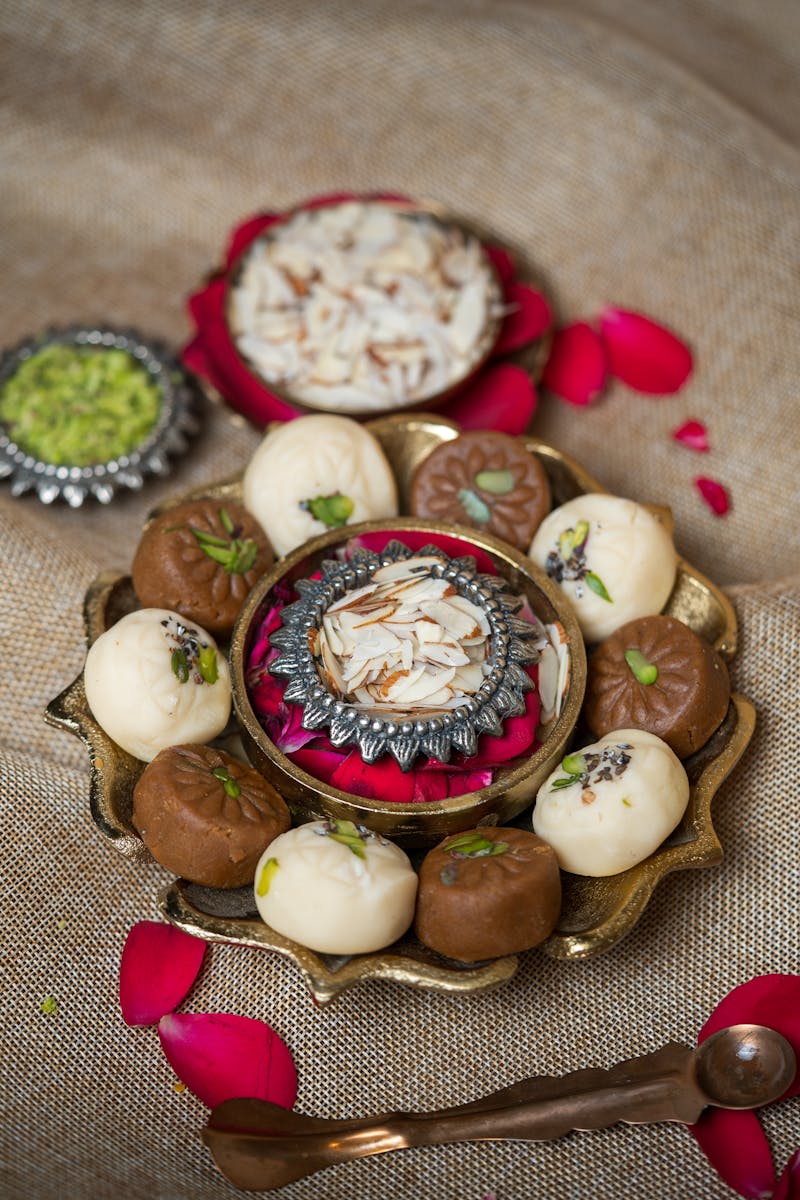Assorted mithai on brass thali
