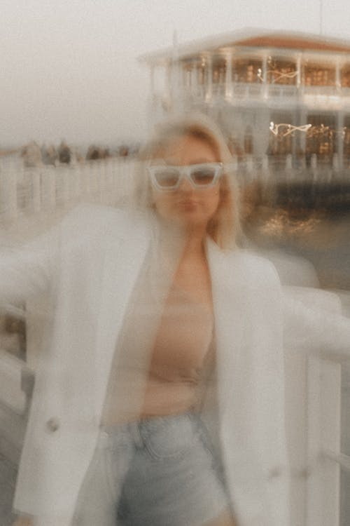 Blonde Woman in White Jacket and Sunglasses