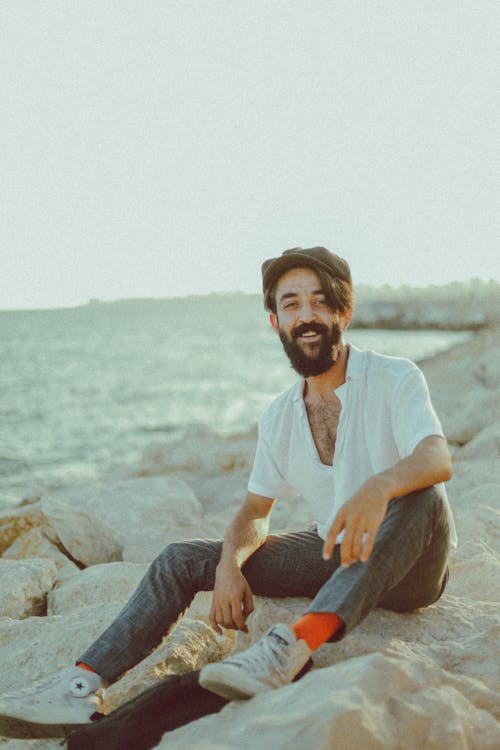 A Man Sitting on a Rock