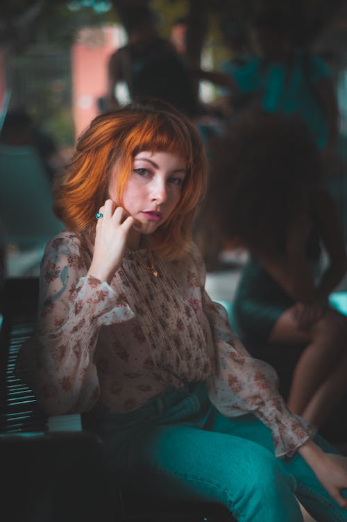 Selective Focus Photography of Woman Sitting on Chair