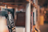 Selective Focus Photography of Books on Shelf