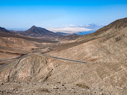 Road among Arid Hills on Canary Islands in Spain