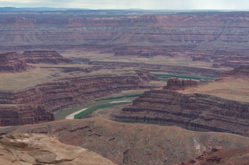 Free A breathtaking aerial view of Dead Horse Point State Park, showcasing layered canyons and the Colorado River. Stock Photo