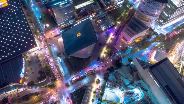 Stunning aerial shot of Ciudad de México illuminated at night with colorful city lights.