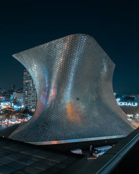 Stunning night view of the modern Museo Soumaya in Mexico City, an architectural masterpiece.