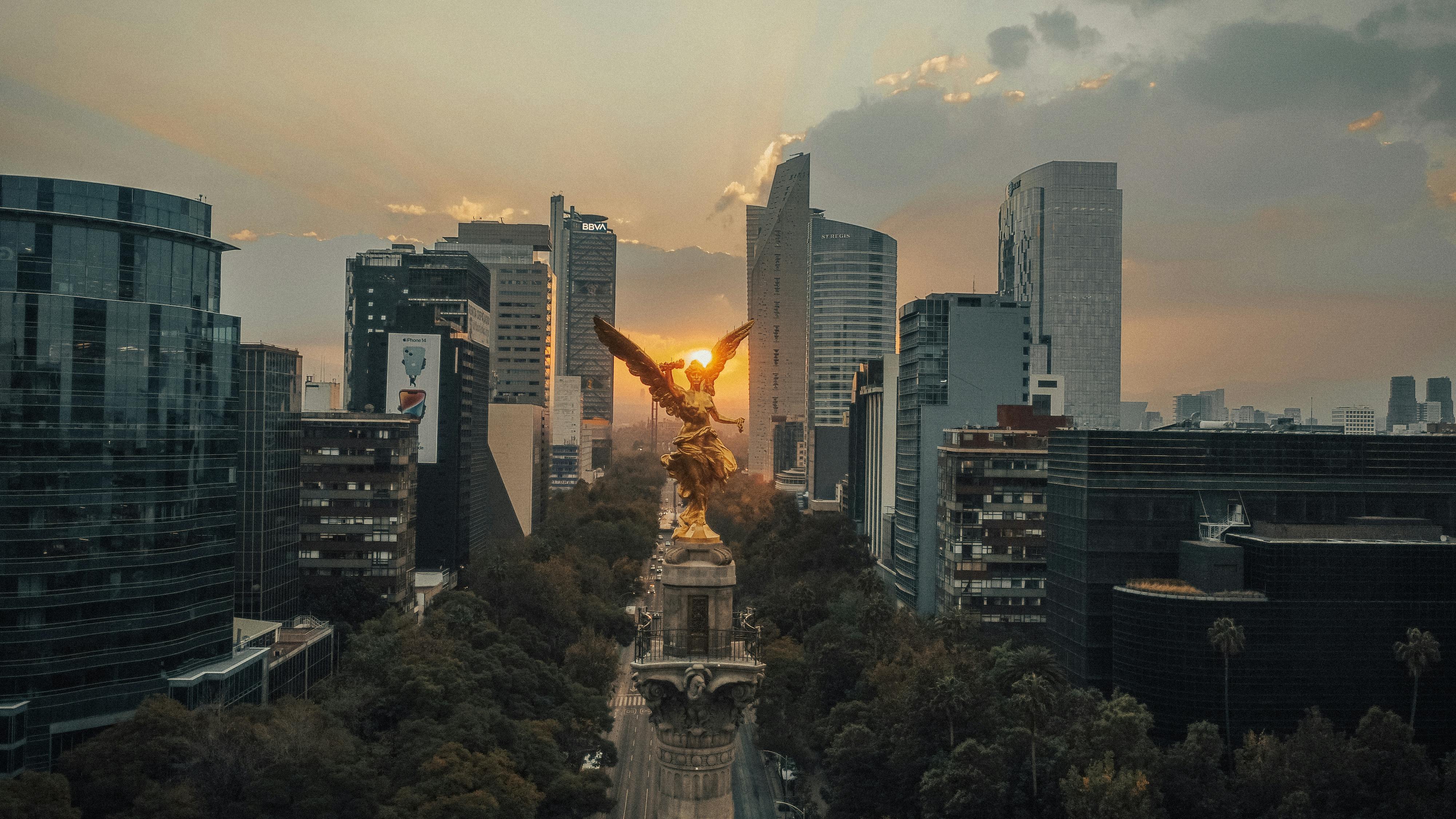 Using travel eSIM in Mexico City — aerial view of the Angel of Independence monument at sunset