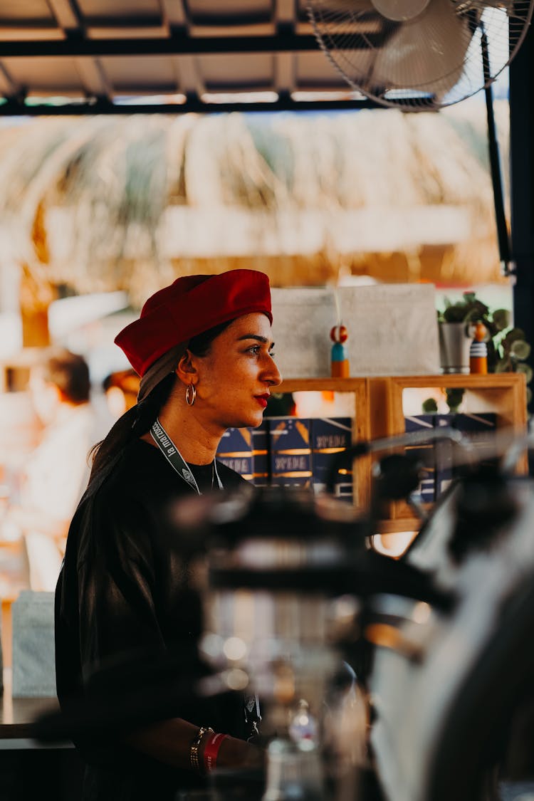 Brunette Woman In Hat Working At Cafe