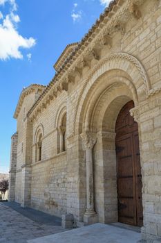 Stunning view of Romanesque church entrance with stone arches in Frómista, Spain. Perfect for architecture enthusiasts.