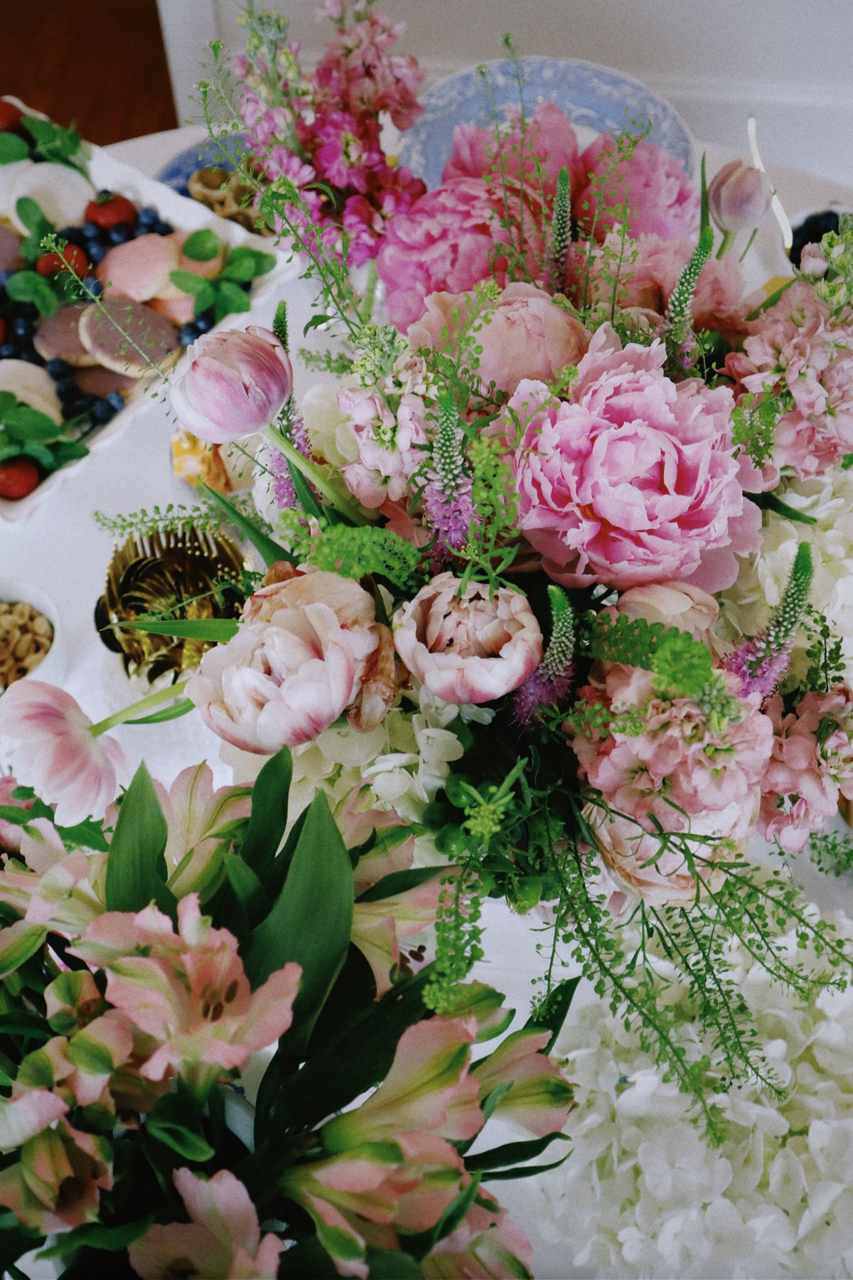 An elegant flower arrangement at a garden party reception