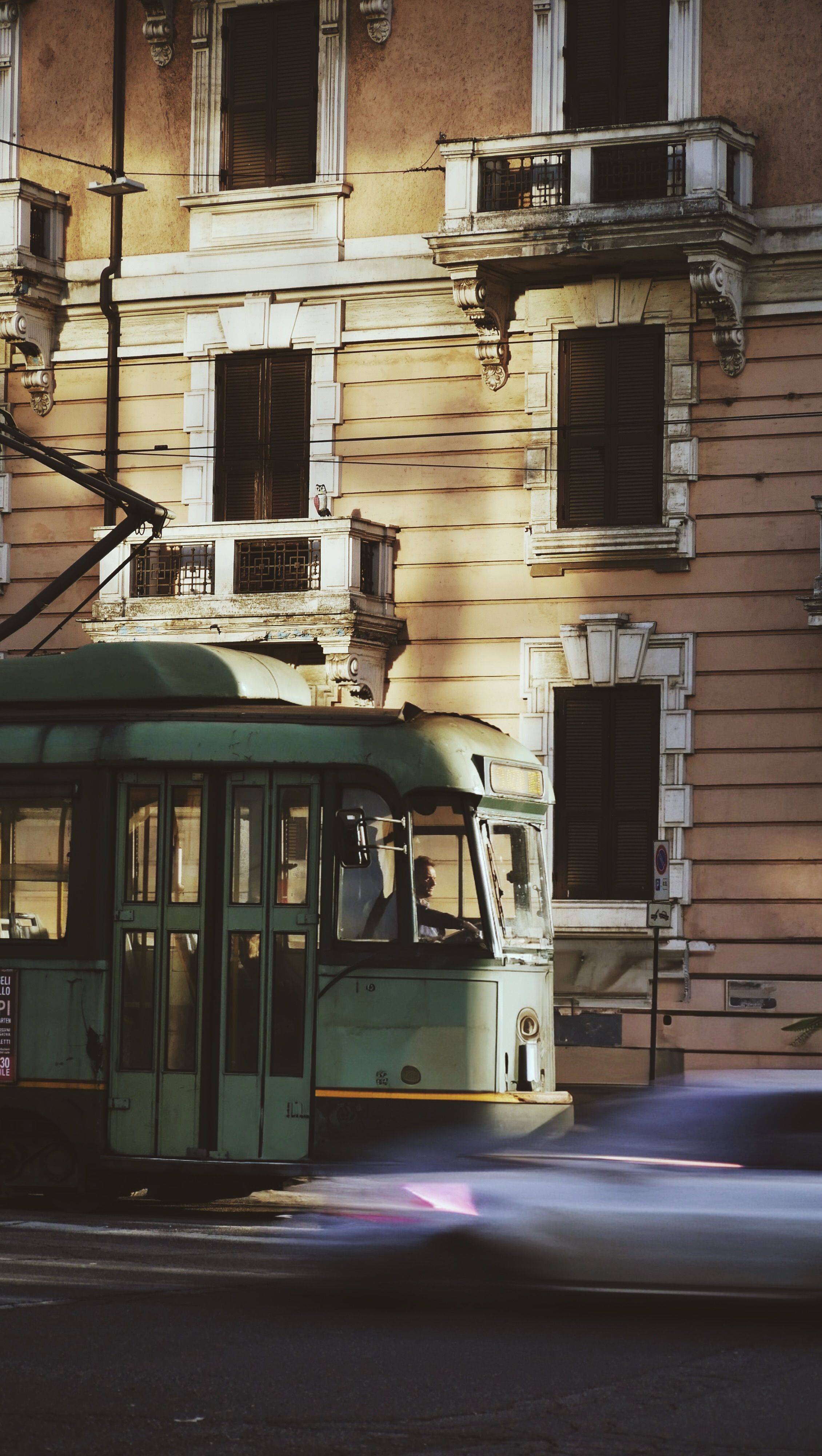How to frame old facades from a moving tram stop — let the street do the work