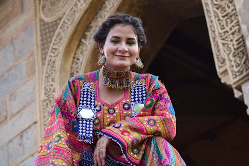 Woman in Traditional Jewelry and Dress