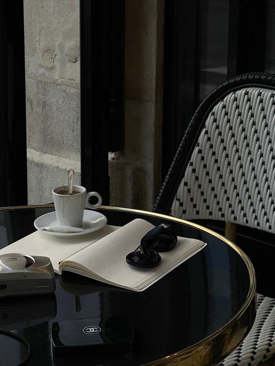 Notepad Cafe Cup of Coffee and Notepad on Cafe Table · Free Stock Photo