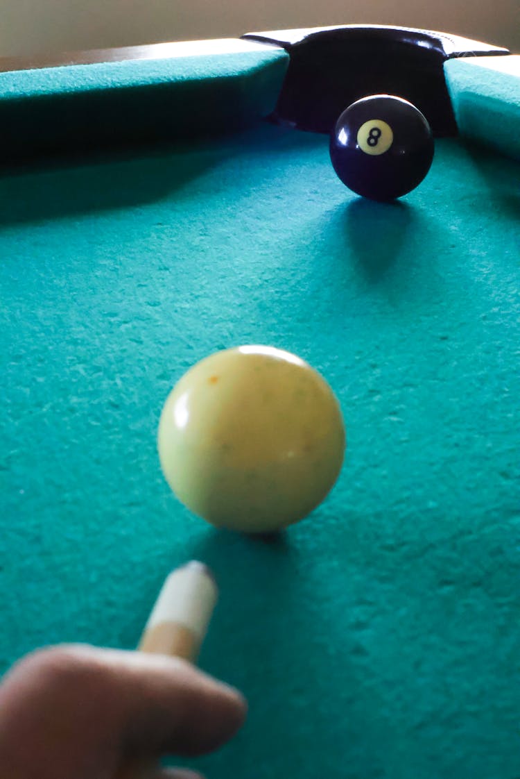 Person Playing Pool