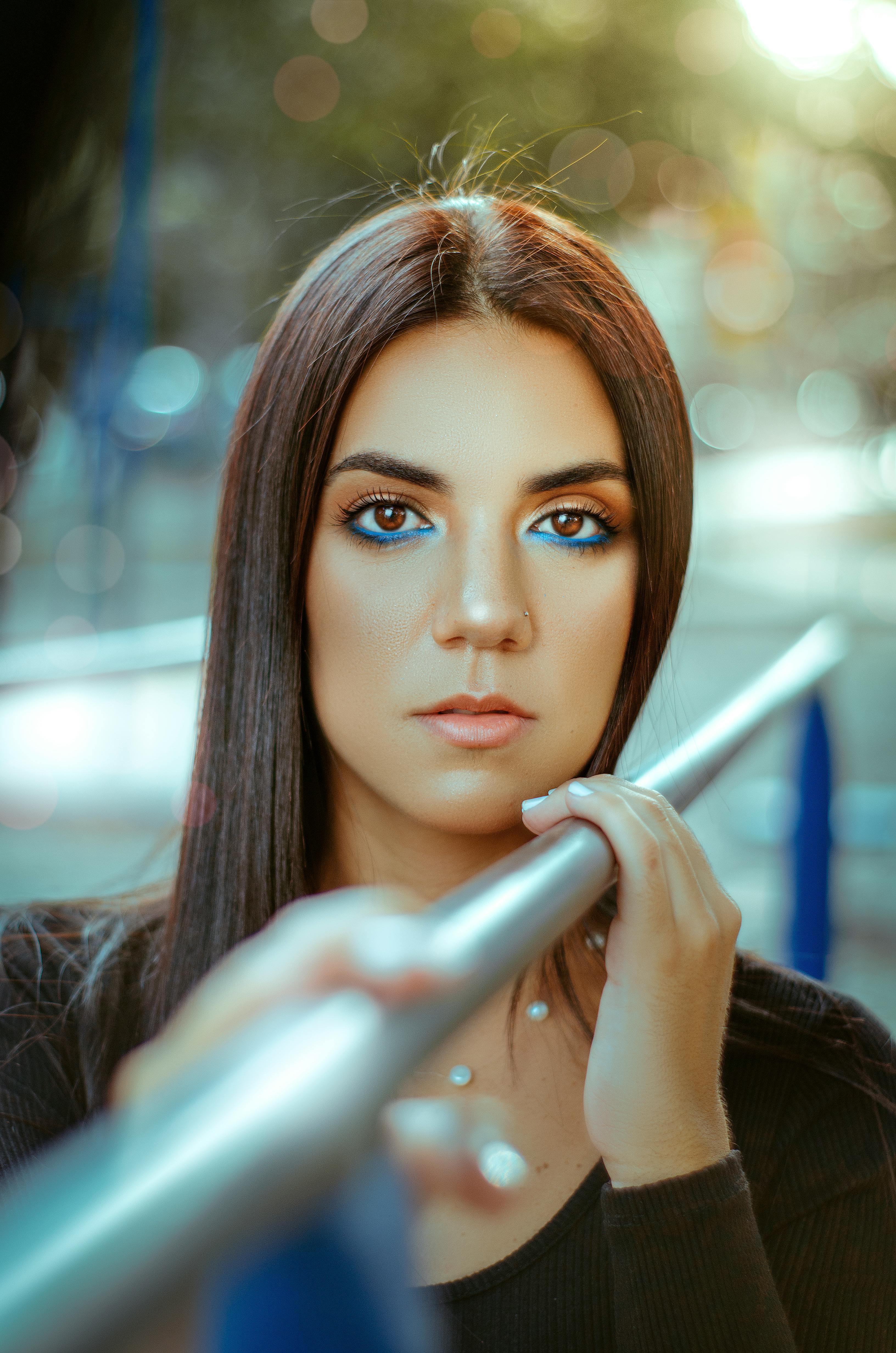 Brunette Woman Face behind Bar · Free Stock Photo