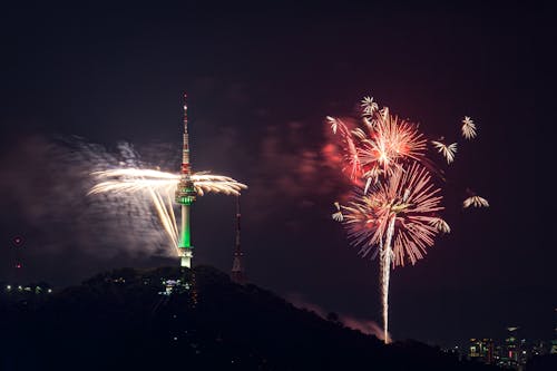 Seoul Tower against Fireworks Display at Night