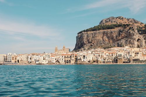 Free Explore the picturesque coastal town of Cefalù with its stunning beaches and rocky cliffs in Sicily. Stock Photo
