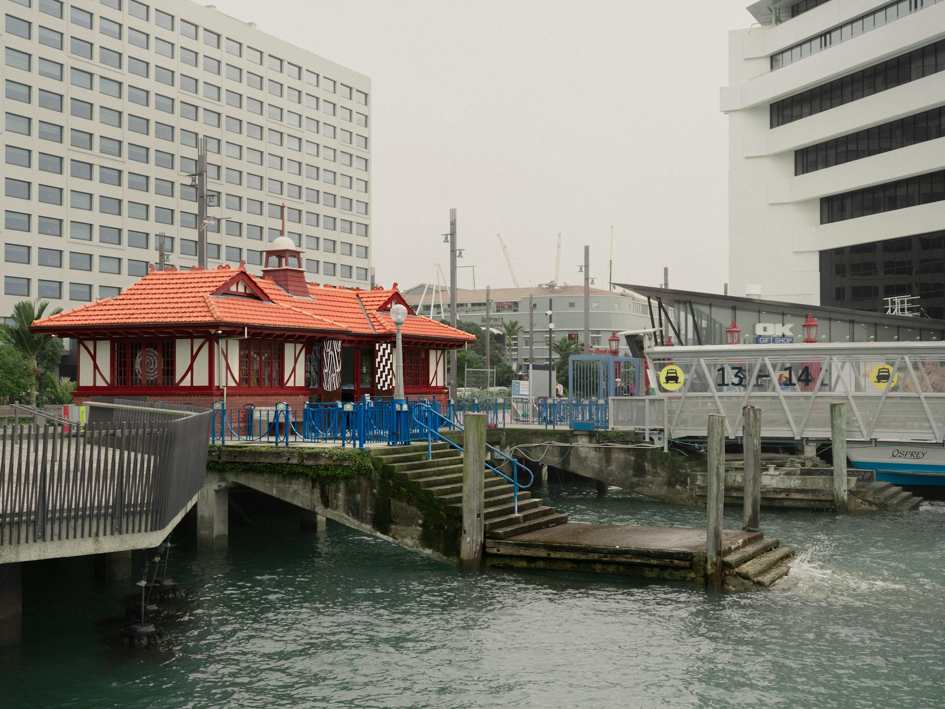 Charming view of historic ferry terminal and waterfront in Auckland, New Zealand.