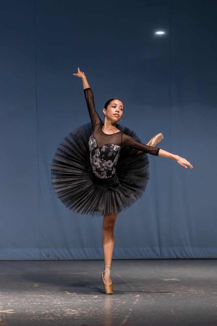 Ballerina Dancing On Stage