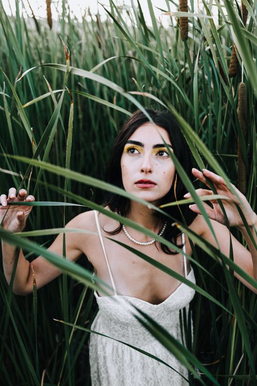 Model With Rushes Face Model with Yellow Eye Shadows Wearing a White Lace Sundress Walking ...