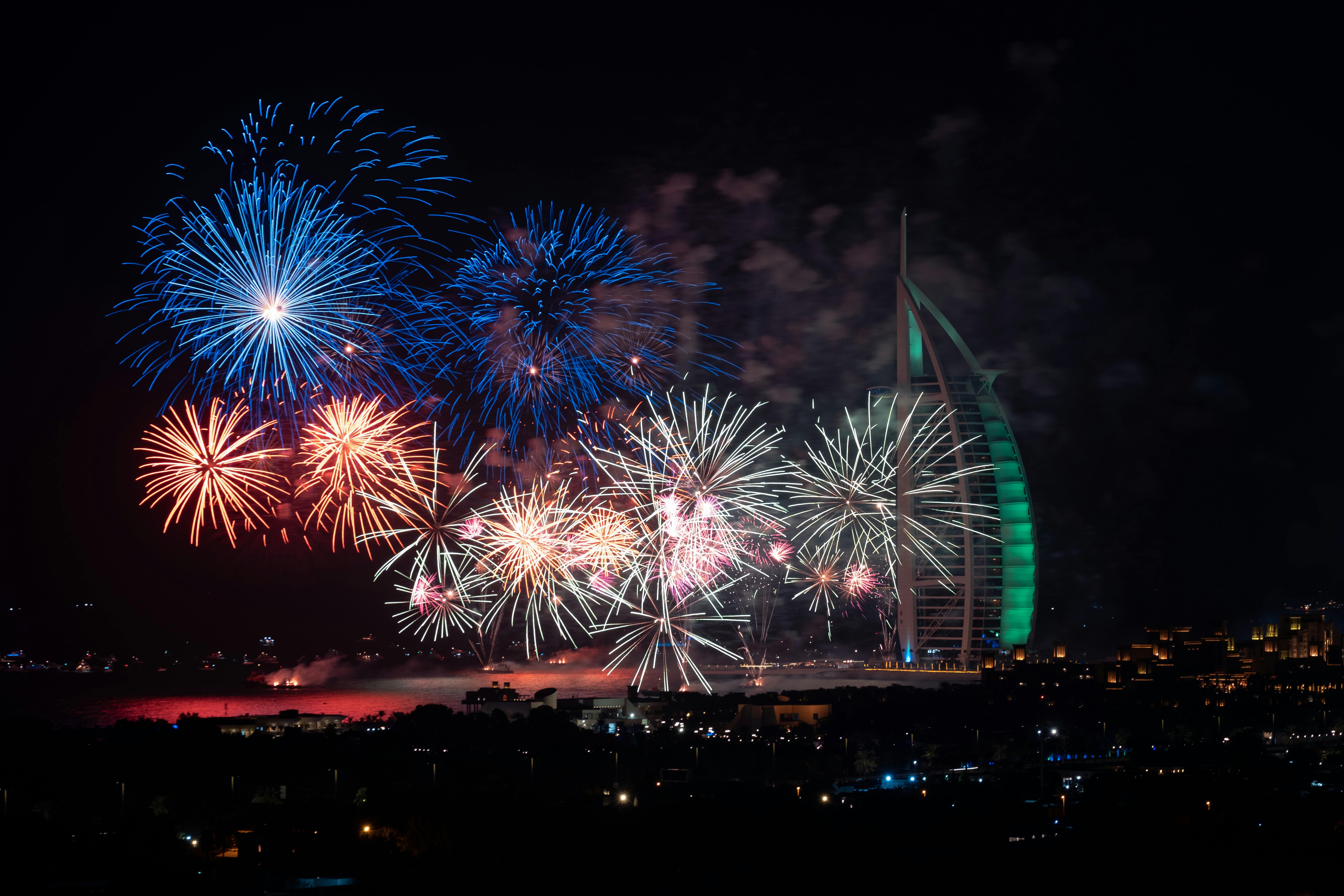 fireworks next to the burj al arab hotel in dubai