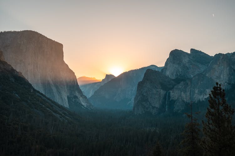 Sunrise Over The Valley Among The Rugged Mountains In Yosemite National Park