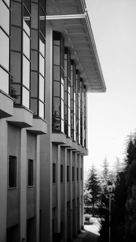 Stunning black and white photo of a modern building facade with bay windows.