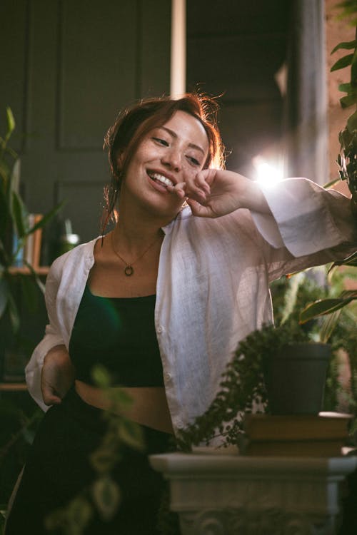 Smiling Woman in White Shirt