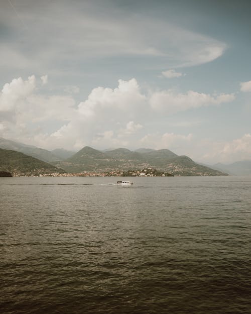 Motorboat on Lake with Hills behind