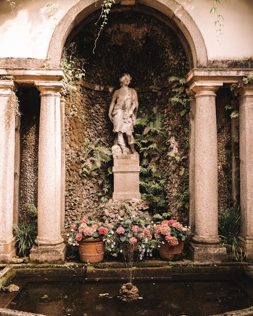 Sculpture and Flowers by Fountain