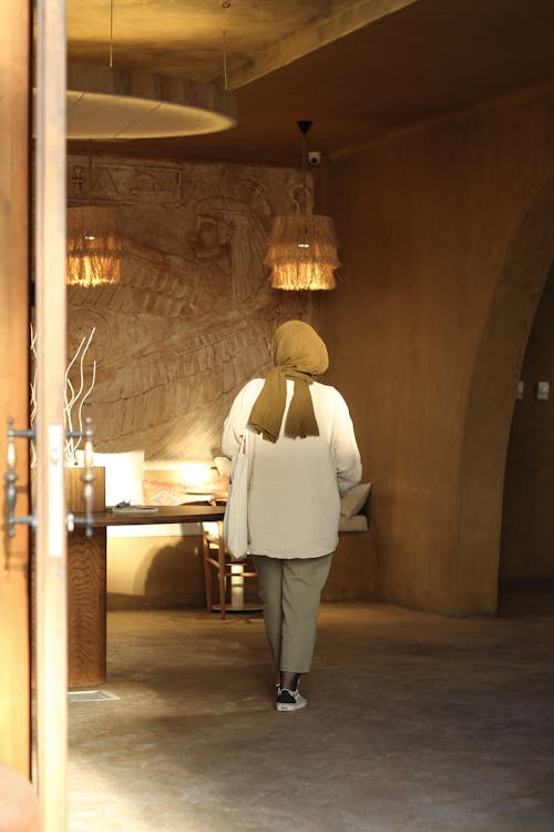 Back View of a Woman in a Casual Outfit and a Hijab 