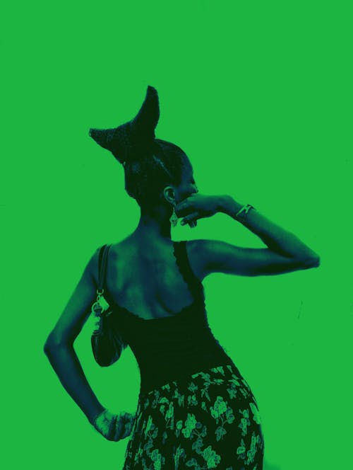 Woman Posing on Green Background