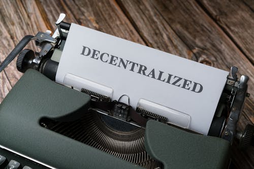 A typewriter with a paper that says decentalized